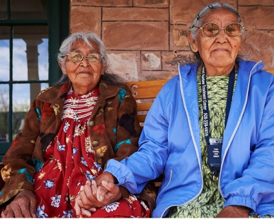 American Indian Women sitting on a bench