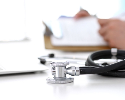 stethoscope sitting on a doctor's desk