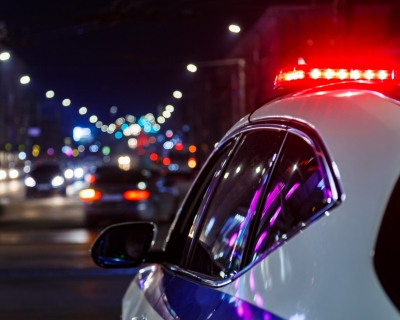 Police car on the road with lights on