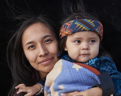 Photograph of mother holding baby.