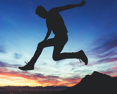 A silhouetted youth leaps across a sunset in Cape Town, South. Africa. Joshua Earle / unsplash